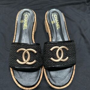 CHANEL Black and Gold Mules